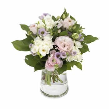 Pastel Spring Flower Bouquet In An Aqua Pack Featuring Soft Pink, Lilac, Cream, And Yellow Blooms With Fresh Greenery.