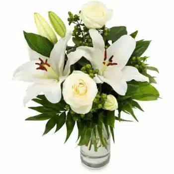 Thinking Of You Flower Bouquet Hand-Tied Bouquet Featuring White Roses And Lilies, Accented With Green Hypericum Berries And Seasonal Foliage.