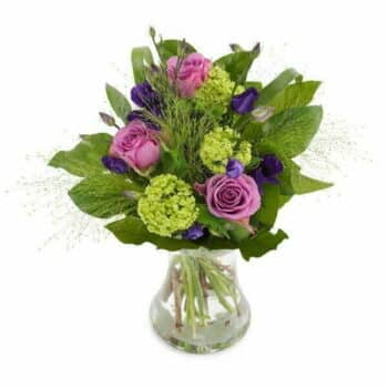 Country Lane Flower Bouquet Featuring Roses, Eustoma, Viburnum, Panicum Grass, And Salal In Calming Purple And Green Shades, Presented In An Aqua Pack.