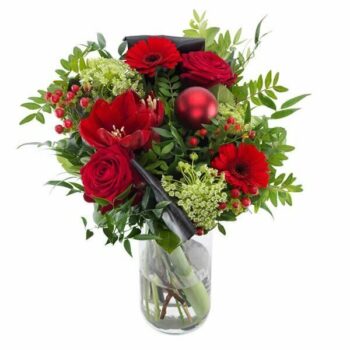 Christmas Wishes Bouquet Featuring Amaryllis, Ammi, Roses, Germini, Hypericum Berries, Pistacia, Aspidistra, And Salal In A Red And White Aqua Pack.