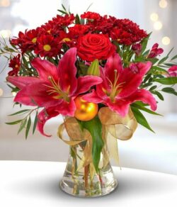 Traditional Christmas Flower Bouquet featuring red Roses, Chrysanthemums, Carnations, pink Lilies, cerise Alstroemeria, and golden baubles.