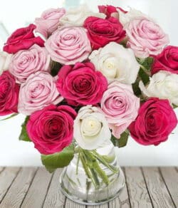 Pink Lace Flower Bouquet featuring a compact, domed arrangement of premium pink roses, hand-tied and presented in a stylish aqua pack.