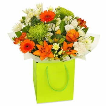 Orange Zest Flower Bouquet A Hand-Tied Bouquet Featuring Bright Orange Roses, Gerberas, Lilies, And Chrysanthemums, Arranged With Lush Greenery For A Vibrant Display.