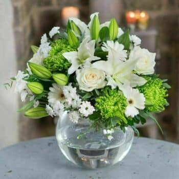 Purity Flower Bouquet Featuring White Oriental Lilies, Cream Roses And Green Blooms, Hand-Tied For A Glamorous And Sophisticated Floral Arrangement.