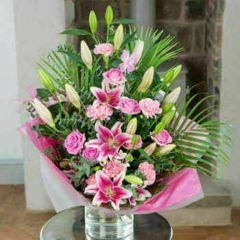 Sweetness Flower Bouquet Featuring Pink Roses, Fragrant Lilies, And Carnations Arranged In A Tall, Front-Facing, Contemporary Design.