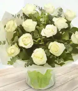 Most Loved Flower Bouquet featuring one dozen pure white Roses, aqua-packed for freshness and ready to display—a timeless and elegant floral gift.