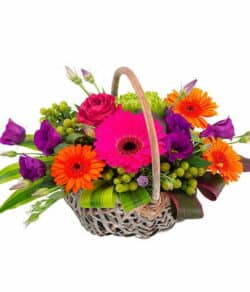Vibrant Flower Basket Featuring Cerise Roses, Gerberas, Orange Roses, Germini, Purple Lisianthus And Green Chrysanthemums Arranged Beautifully.