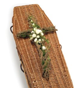 Contemporary Cross Funeral Tribute made from natural bark and twine, featuring a white rose spray with complementary greenery.