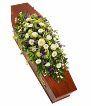 Purple And White Coffin Spray Eaturing Roses, Germini, Carnations, Viburnum, And Lisianthus With Lush Greenery In A 3Ft Design.