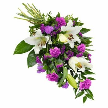 Purple And White Lily Sheaf Featuring White Lilies, Purple Statice, Dianthus, Ageratum, And Decorative Greenery Arranged As A Flat Tribute.