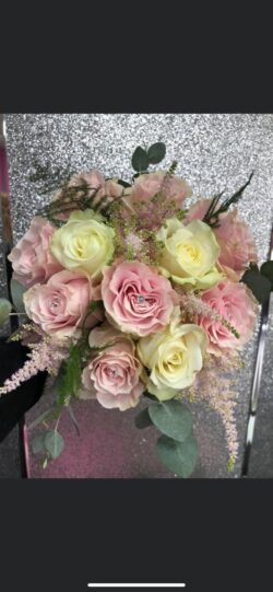 Wedding Day Flower Design Luxurious wedding flower arrangement with seasonal blooms and greenery, designed for an elegant and romantic celebration.