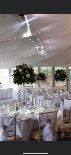 Wedding Flower Design Luxurious wedding flower arrangement with seasonal blooms and greenery, designed for an elegant and romantic celebration.