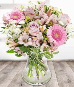 Reflection Flower Bouquet featuring lilac roses, pink gerberas, white chrysanthemums and alstroemeria arranged in a vase by expert florists.