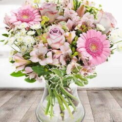 Reflection Flower Bouquet Featuring Lilac Roses, Pink Gerberas, White Chrysanthemums And Alstroemeria Arranged In A Vase By Expert Florists.