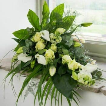Pure Flower Spray Elegant Floral Spray Featuring Cream Roses, Calla Lilies, And Fragrant Eucalyptus Foliage Arranged In A Classic Elongated Design.