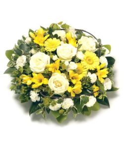 Yellow Flower Posy Yellow and white posy arrangement featuring roses, freesias, carnations, and complementary foliage with a neat foliage edge.