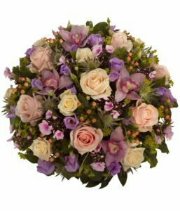 Funeral Posy With White Roses, Lilies, And Greenery Symbolising Peace, Remembrance, And Sympathy.