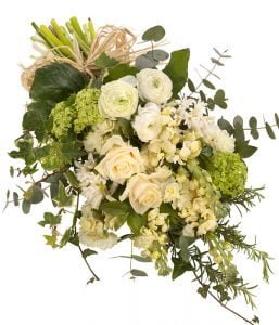 Elegant Funeral Sheaf Featuring White Lilies, Roses, And Lush Greenery Arranged In A Natural, Hand-Tied Design For A Memorial Tribute.