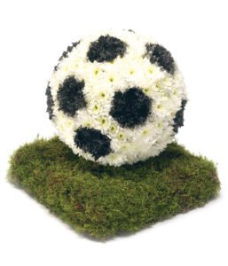Floral Football Tribute Made With Fresh Blooms, Designed As A Heartfelt Funeral Arrangement For A Football Fan