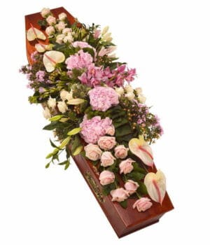 Elegant Floral Arrangement On Casket.