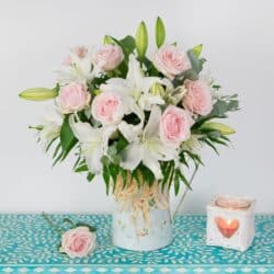 Radiance Flower Bouquet featuring white oriental lilies and elegant roses arranged in a luxurious, fragrant design perfect for any occasion.