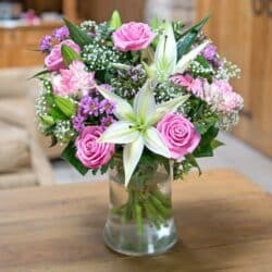 Beautiful Flower Bouquet featuring oriental lilies, pink carnations, roses, and gypsophila arranged in a delicate mix of pink and white hues.
